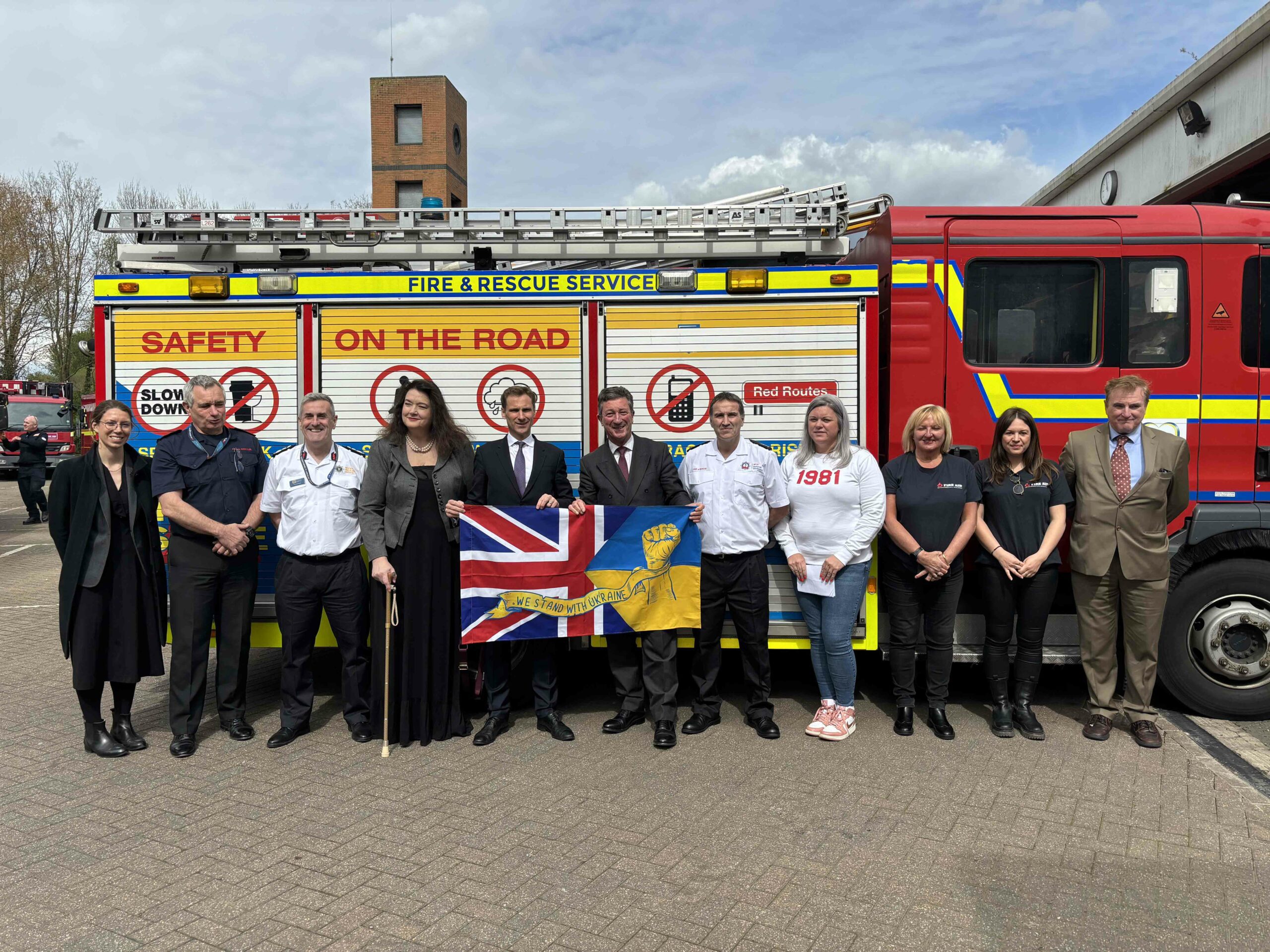 Minister with representatives from NFCC, National Resilience, FIRE AID, Fire Industry Association, and Kent Fire and Rescue Service.